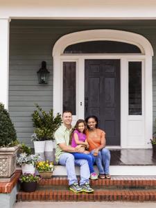 The Cobb-Hoppers on the porch of their new home.
